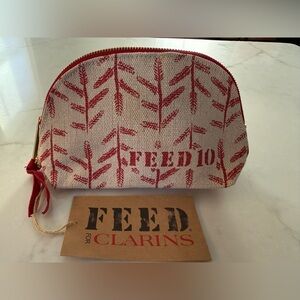 New! FEED x Clarins Small Toiletry Makeup Cosmetic  Zippered Pouch Bag Tan Red